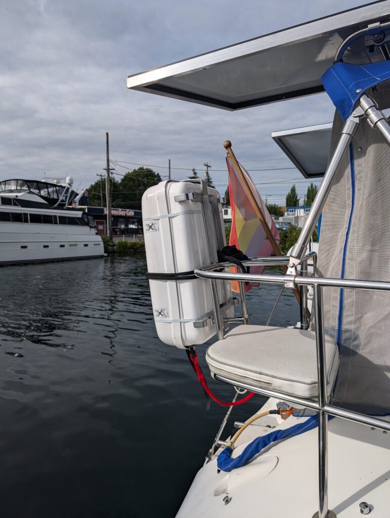 Life raft mounted in cradle